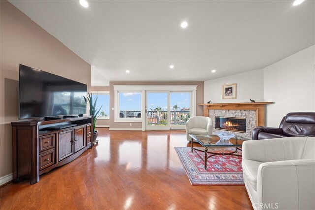 living room with a fireplace and light hardwood / wood-style floors