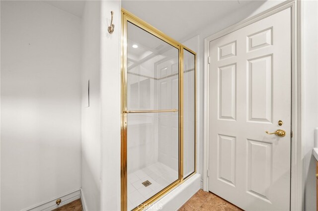 bathroom with a shower with shower door