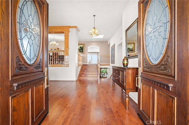 entryway featuring a notable chandelier and hardwood / wood-style floors