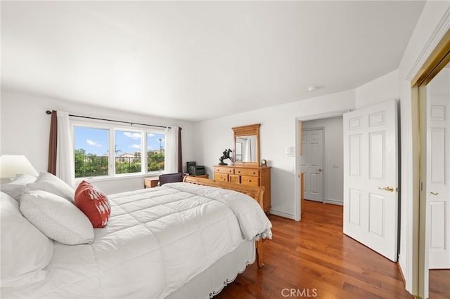 bedroom featuring dark wood-type flooring