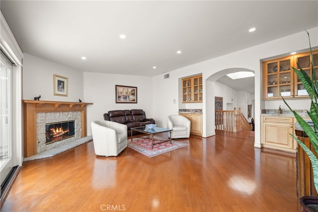 living room featuring hardwood / wood-style flooring and a fireplace