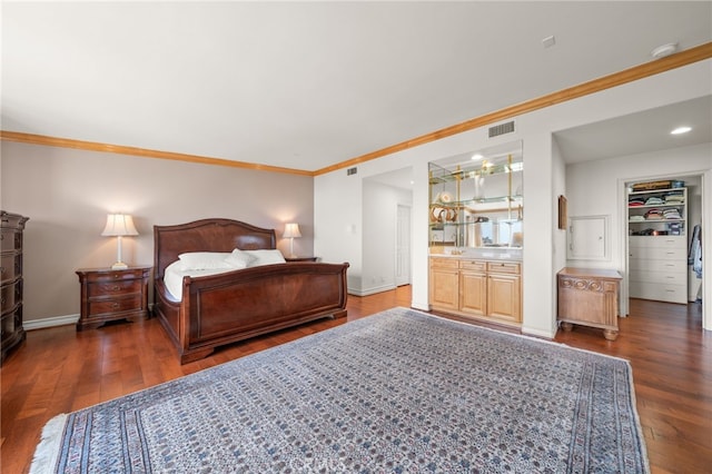 bedroom featuring crown molding and dark hardwood / wood-style floors