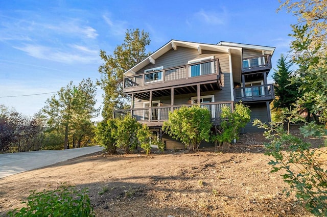 back of property featuring a deck