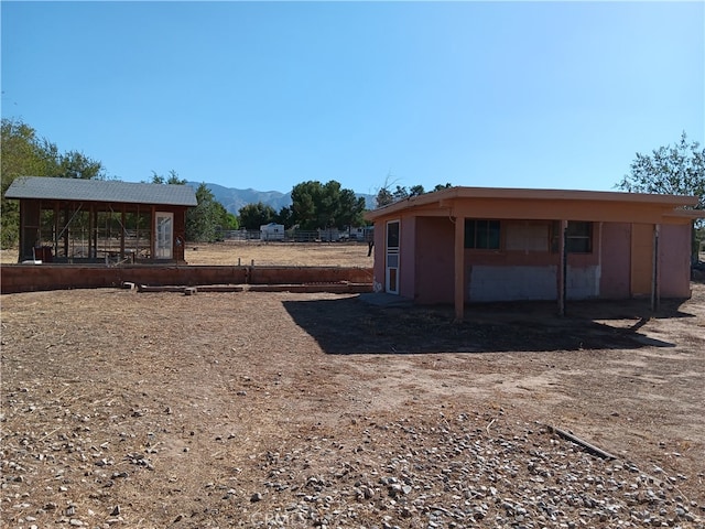 view of outbuilding with a mountain view