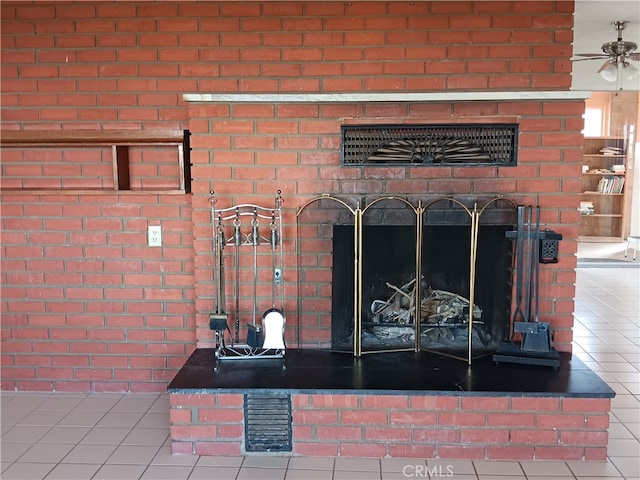 details with ceiling fan, a fireplace, and tile patterned flooring