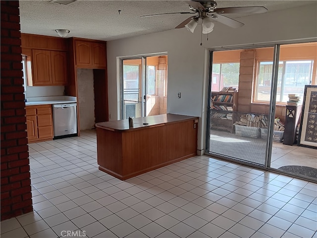 kitchen featuring ceiling fan, light tile patterned flooring, kitchen peninsula, a textured ceiling, and dishwasher