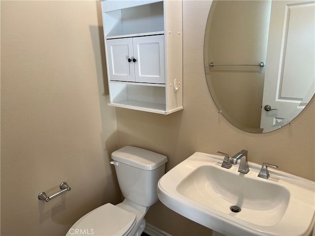 bathroom with sink and toilet