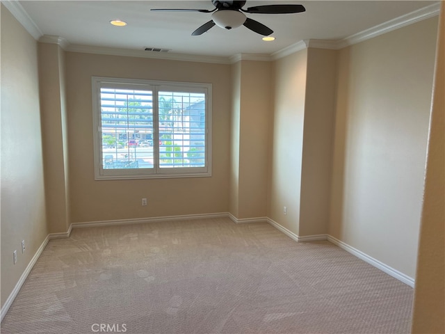 unfurnished room with ornamental molding, ceiling fan, and light carpet