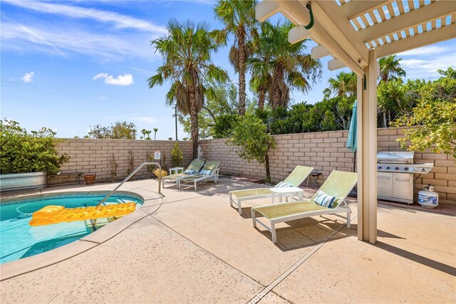 view of patio / terrace with a grill, a fenced in pool, and a pergola