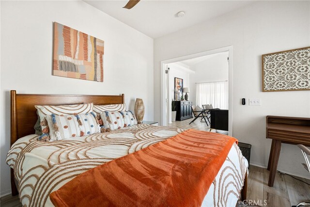 bedroom featuring hardwood / wood-style flooring and ceiling fan