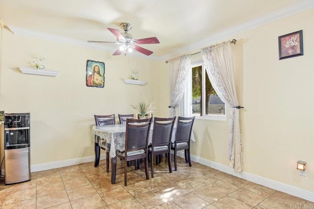 dining area with ceiling fan and crown molding