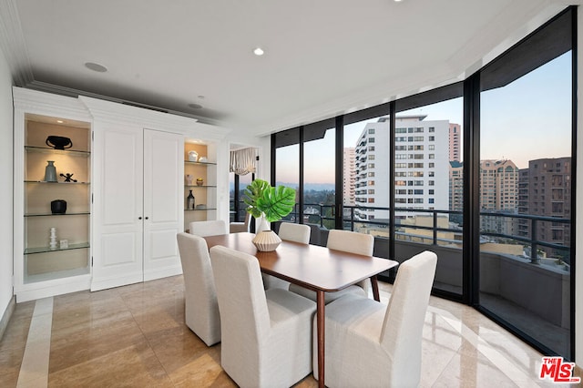 dining area featuring built in shelves and floor to ceiling windows