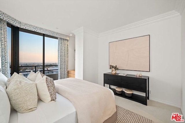 carpeted bedroom featuring crown molding