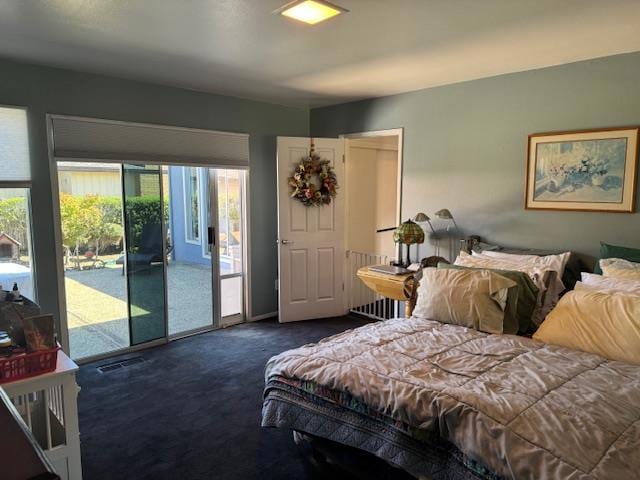 carpeted bedroom with radiator and access to outside