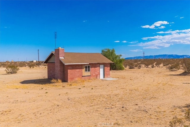 view of side of property featuring a mountain view