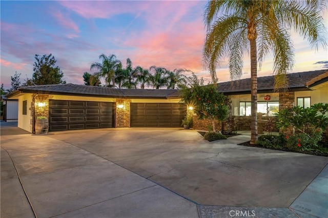 single story home with a garage