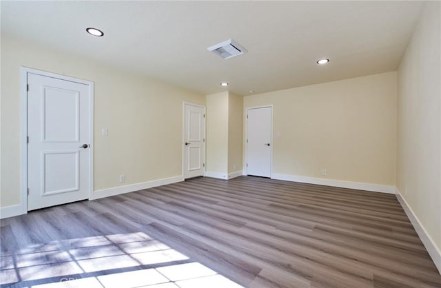 spare room with light hardwood / wood-style flooring