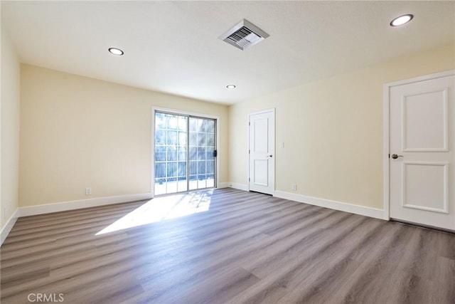 spare room with light wood-type flooring