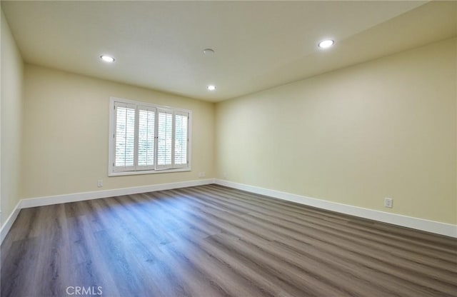 spare room featuring hardwood / wood-style flooring