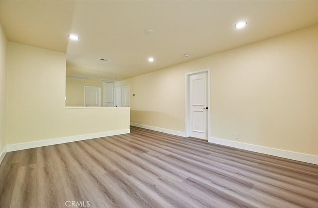 spare room with light hardwood / wood-style flooring