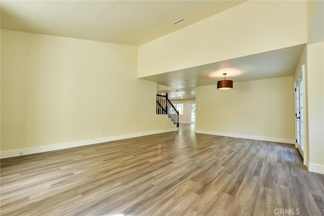 unfurnished living room featuring hardwood / wood-style floors