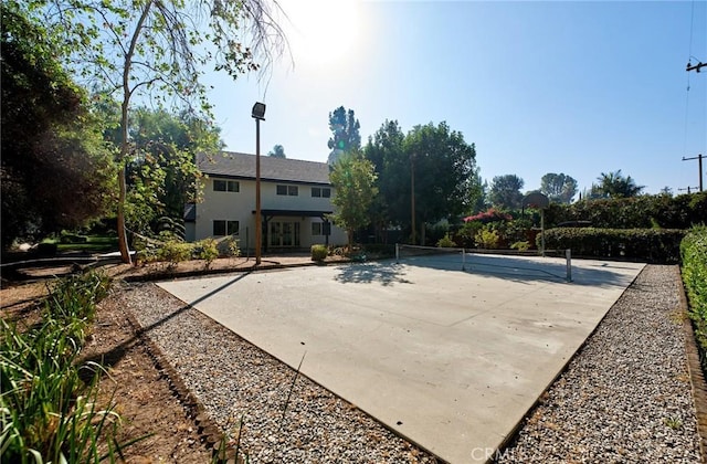 exterior space featuring tennis court