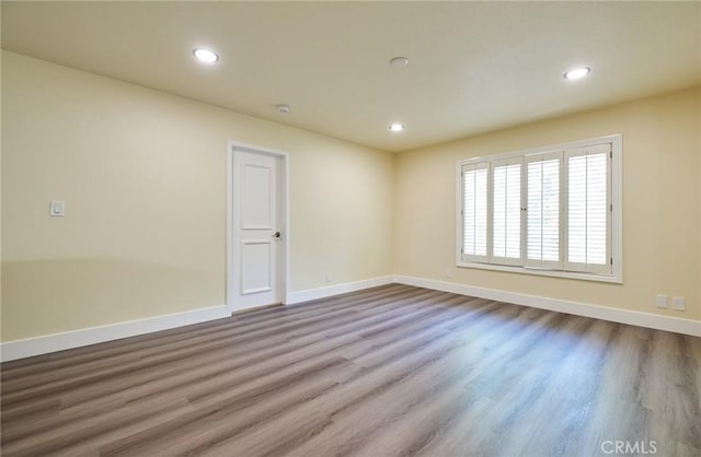 empty room featuring wood-type flooring