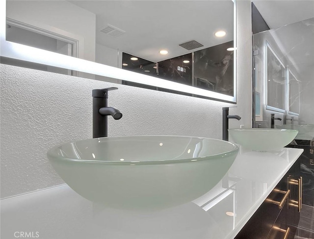 bathroom featuring a tub and vanity