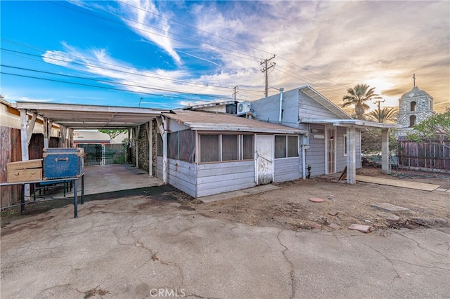 view of front of home featuring a patio and central air condition unit