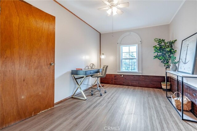 office space with ceiling fan, light wood-type flooring, and ornamental molding