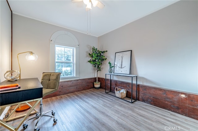 office space featuring ornamental molding, ceiling fan, and light hardwood / wood-style floors