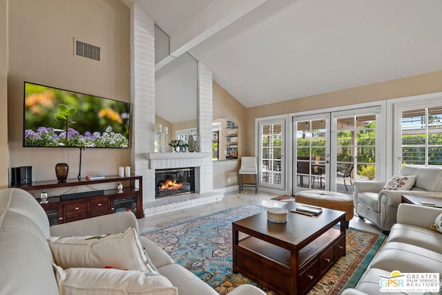 living room featuring a fireplace, beam ceiling, and high vaulted ceiling