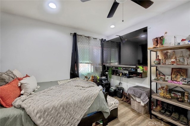 bedroom featuring light hardwood / wood-style floors and ceiling fan