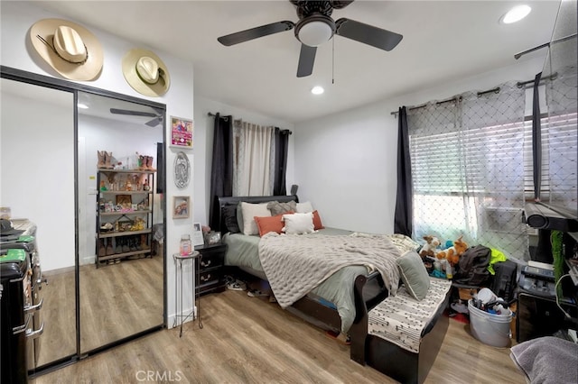 bedroom featuring light wood-type flooring and ceiling fan