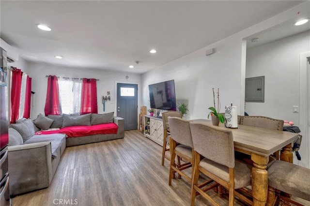 dining space featuring hardwood / wood-style flooring and electric panel