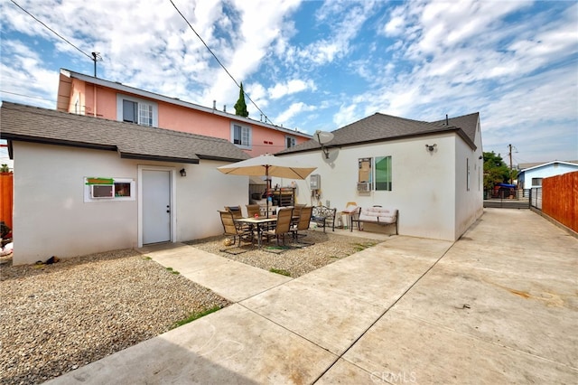 rear view of house featuring a patio