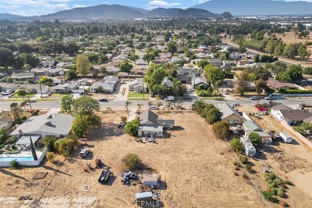 birds eye view of property featuring a mountain view