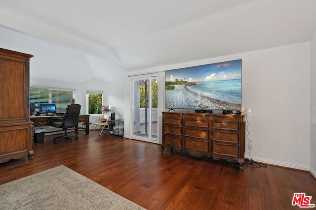 home office featuring lofted ceiling and dark hardwood / wood-style flooring