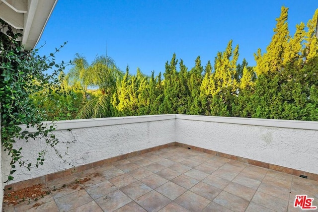 view of patio with a balcony