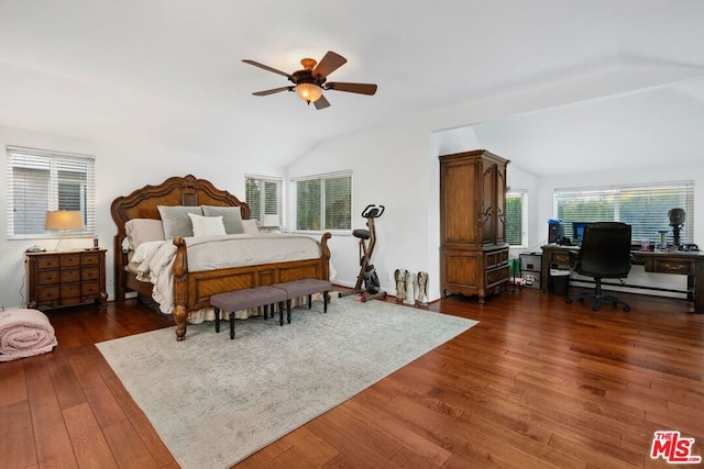 bedroom featuring vaulted ceiling, multiple windows, ceiling fan, and dark hardwood / wood-style flooring