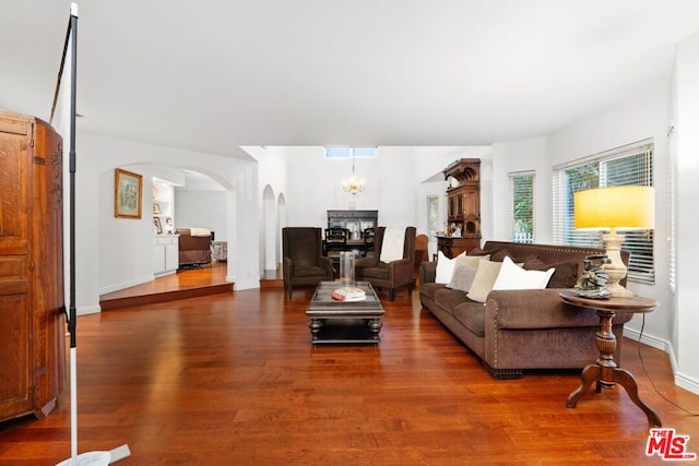 living room featuring a notable chandelier and hardwood / wood-style floors