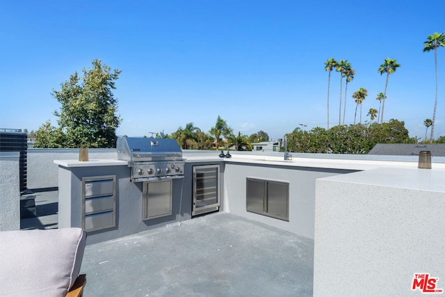 view of patio / terrace featuring area for grilling, exterior kitchen, and beverage cooler