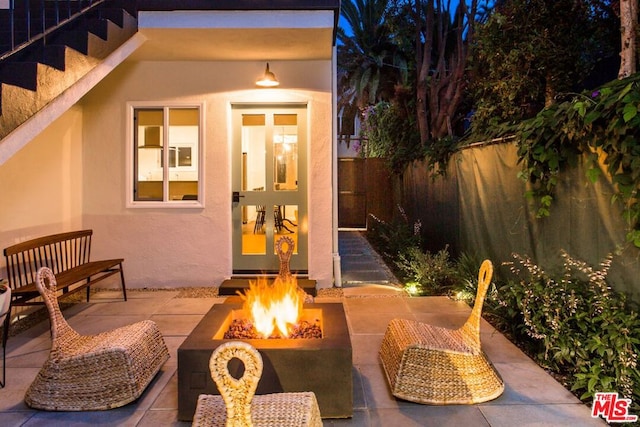 view of outbuilding with a fire pit