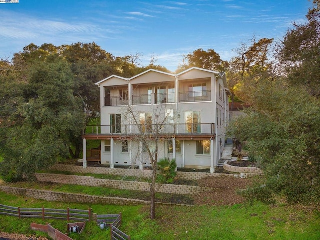 back of house with a balcony