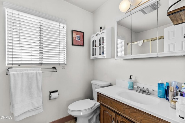 bathroom with toilet and vanity