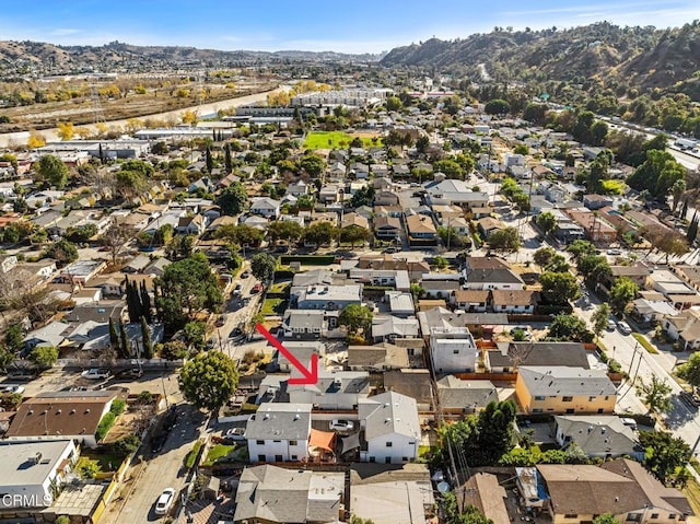 birds eye view of property with a mountain view