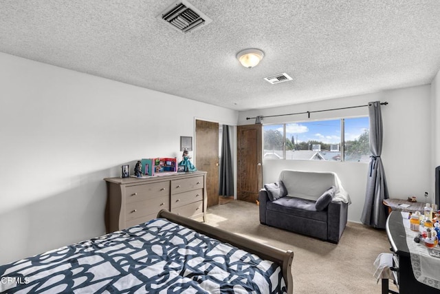 carpeted bedroom with a textured ceiling