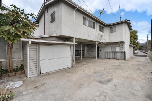 back of house with a garage