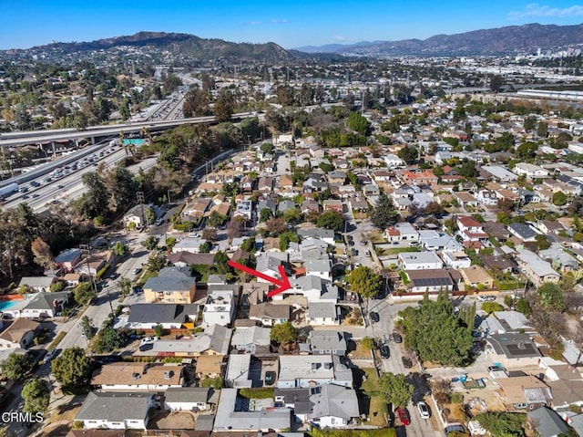 birds eye view of property with a mountain view