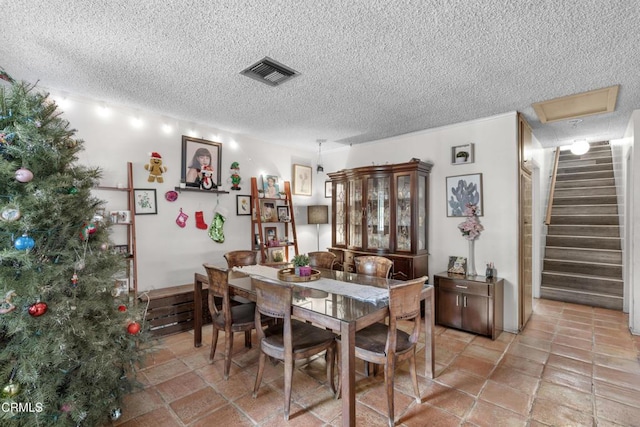 dining area with a textured ceiling